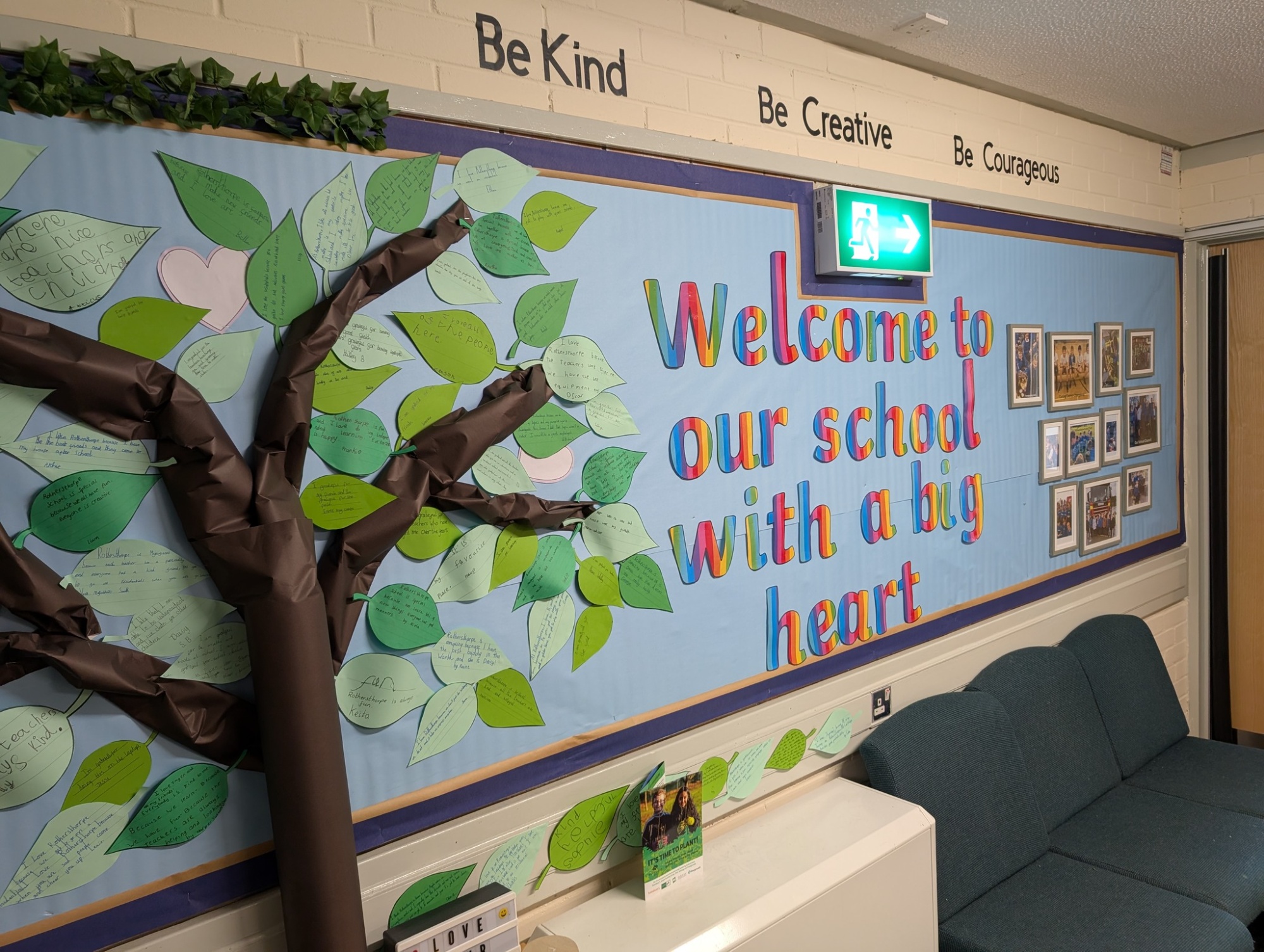 entrance display featuring a tree and the words 'welcome'